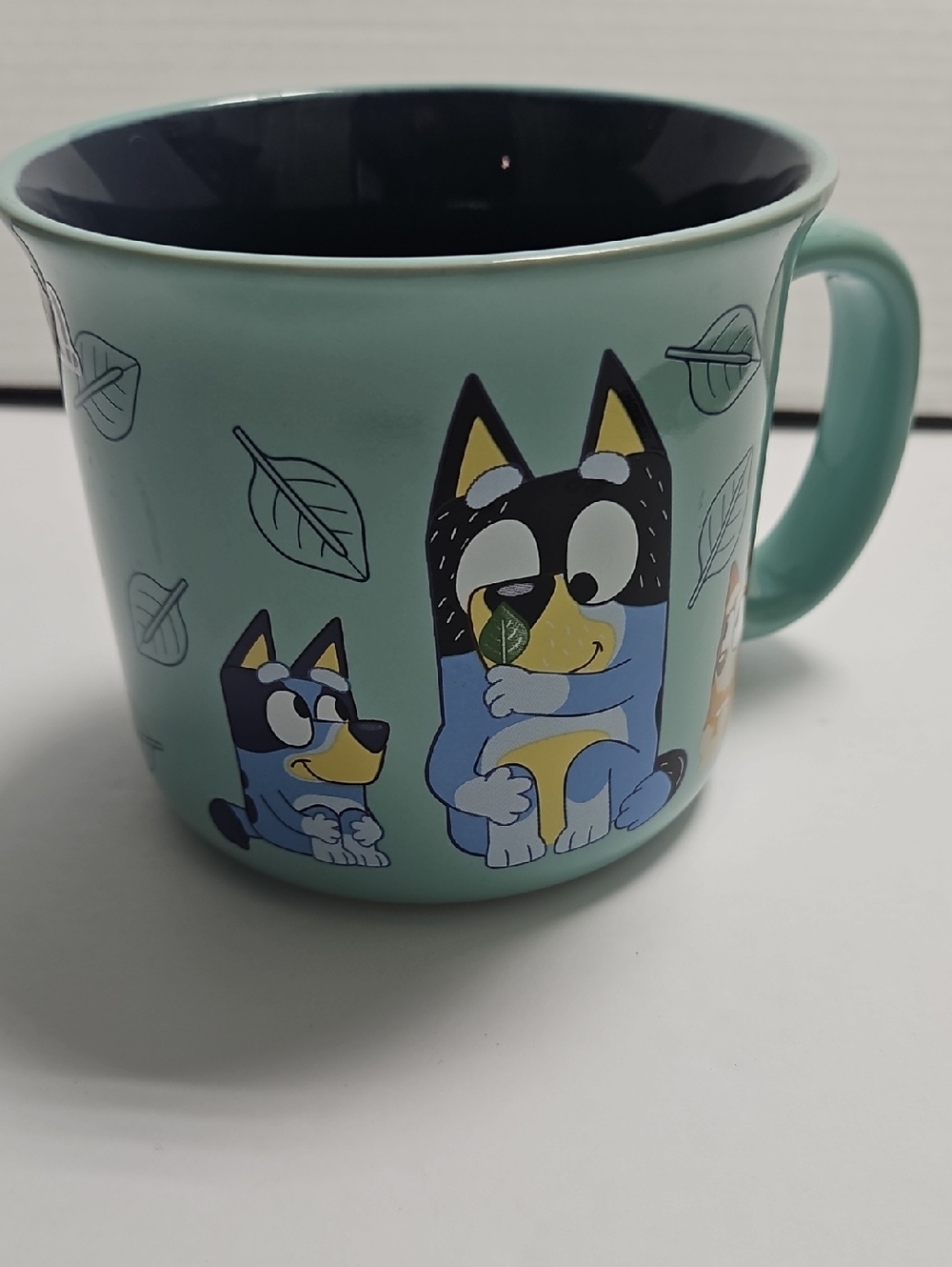 Cartoon Blue Heeler "Bluey" Ceramic Mug - Teal Exterior, Navy Interior
